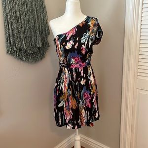 One shoulder floral Anthropologie dress with pleated skirt. Silky feel, size 4.